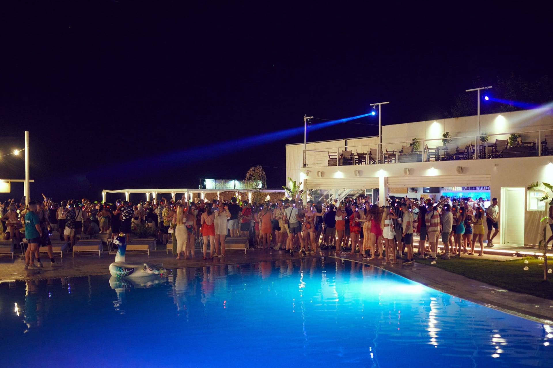 Night party by the pool at El Paradiso Beach Club, Laganas, under laser lights